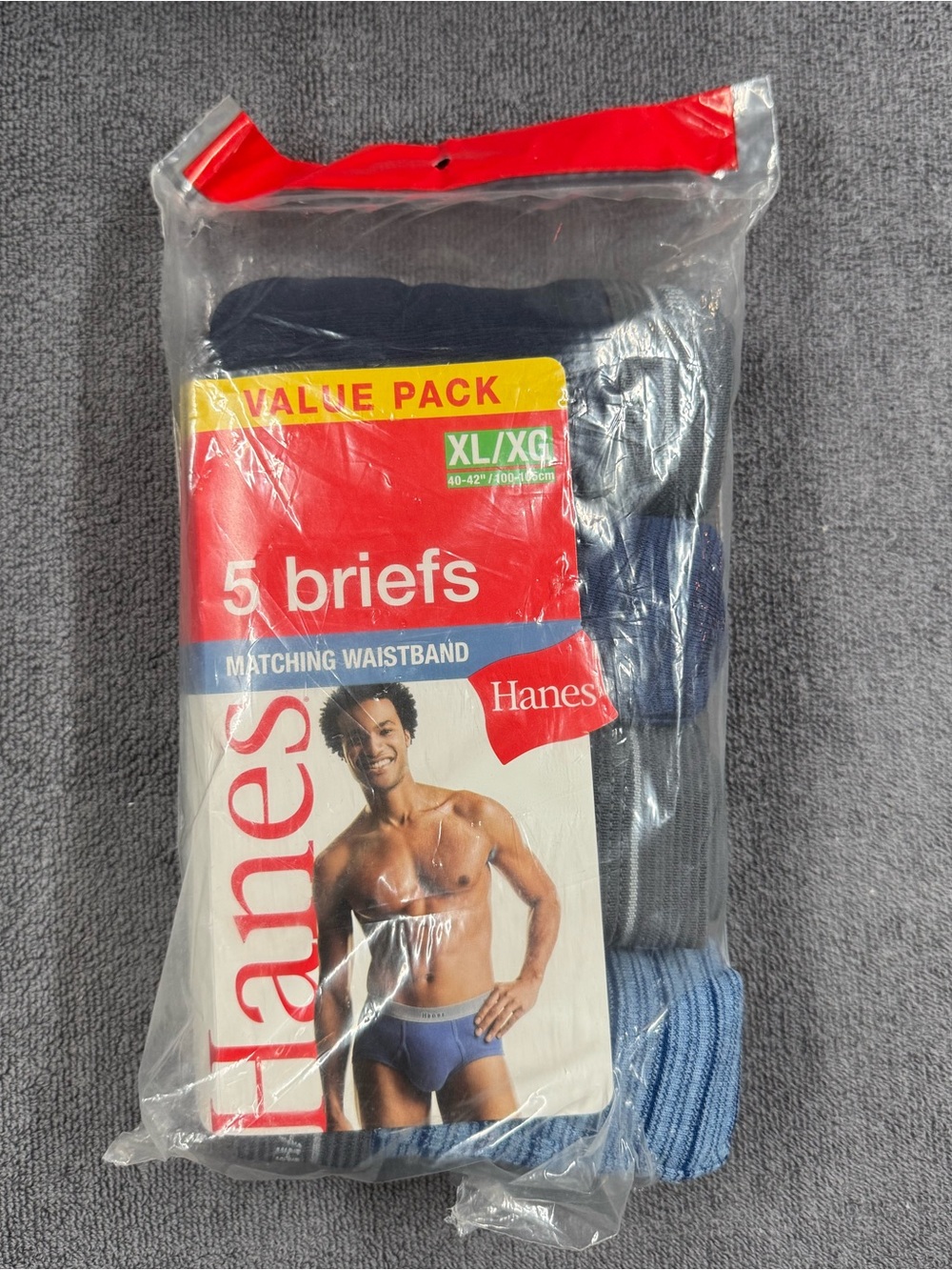 Four vintage men's Hanes fashion briefs with dark gray waistband